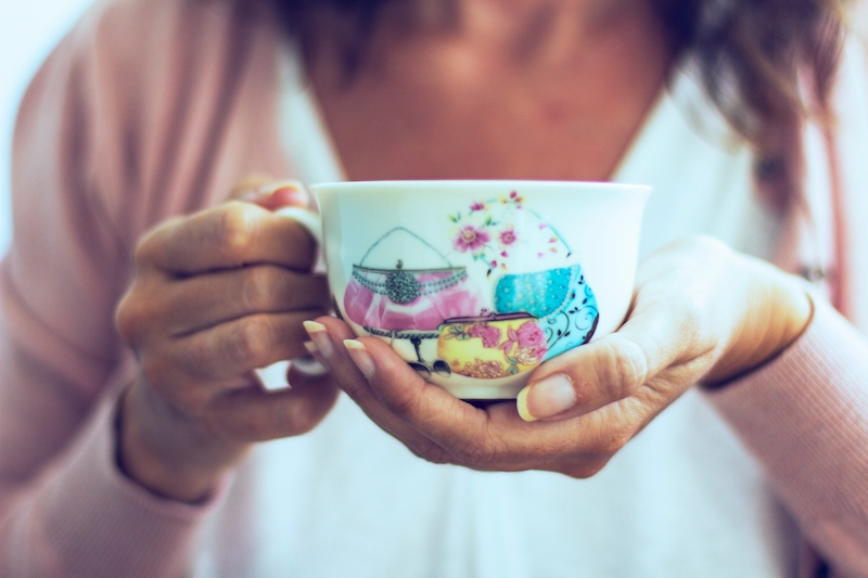 woman holding a cup