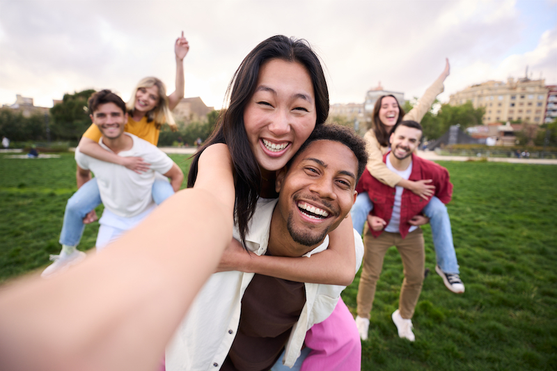 Multirracial group of friends taking selfie picture 