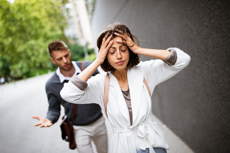 Frustrated couple arguing and having marriage problems outdoor