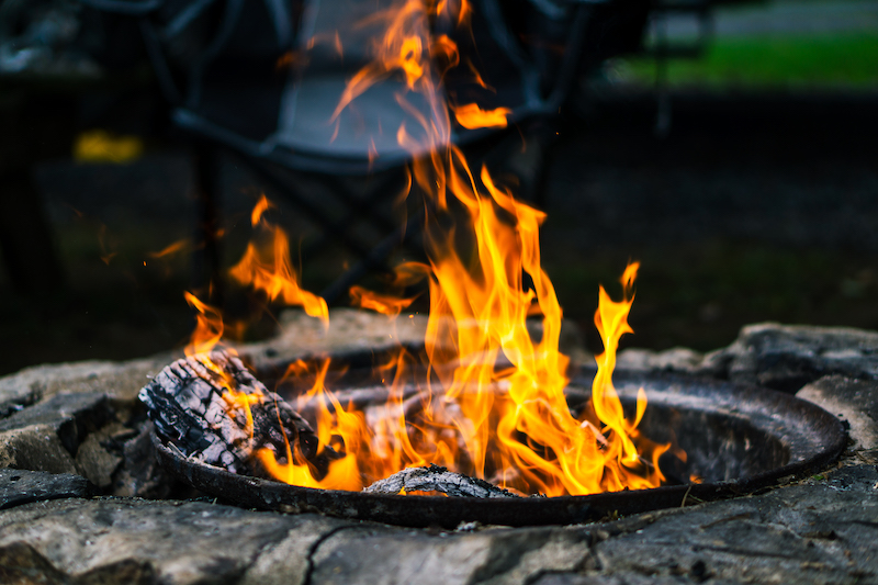A burning wood and red flames of fire