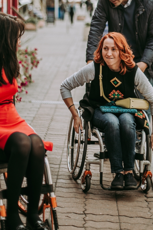 two ladies in a wheelchair