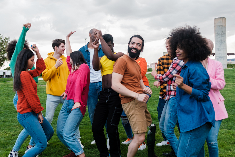 Group of people dancing in the park
