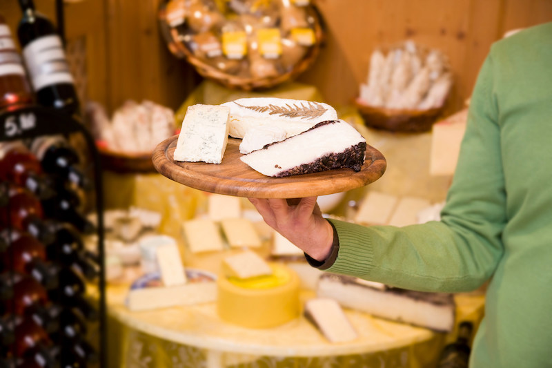 cheese and wine store owner in shop