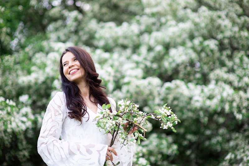 young woman holding flowers