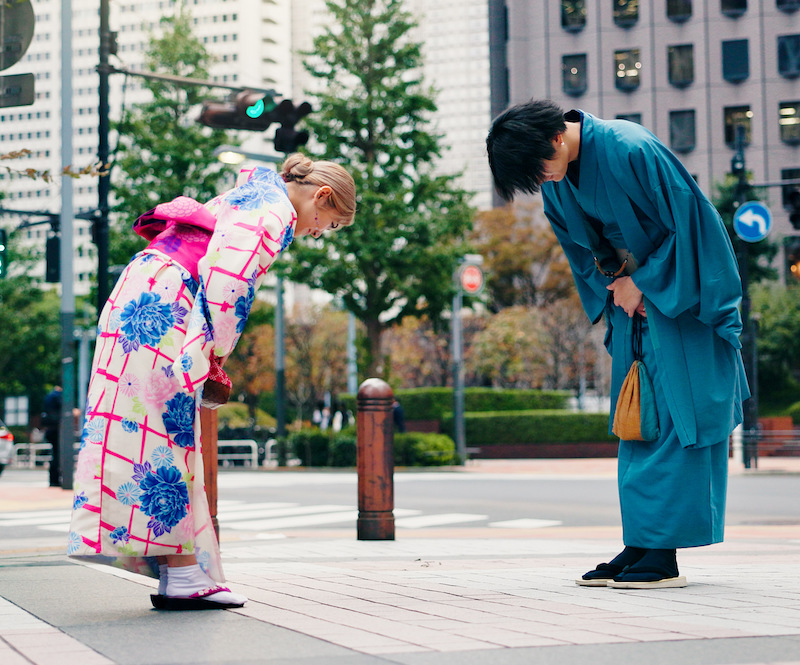 japanes people bowing to each other out of respect