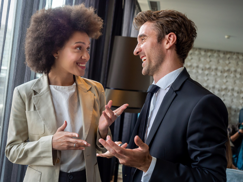 Happy business colleagues talking