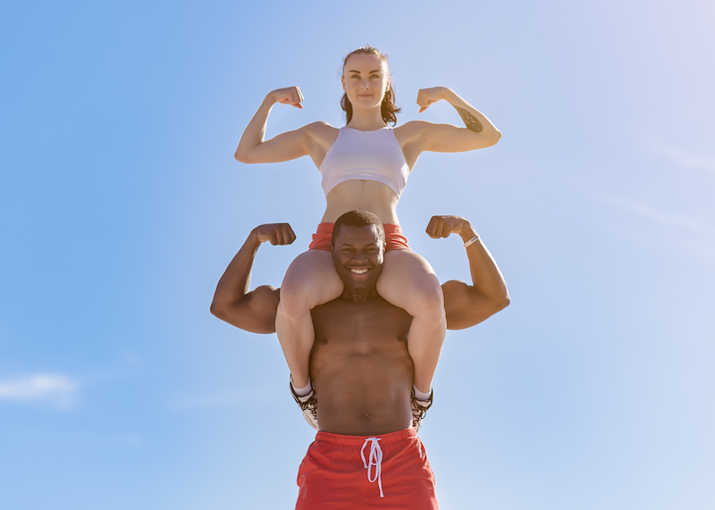 a fit couple flexing