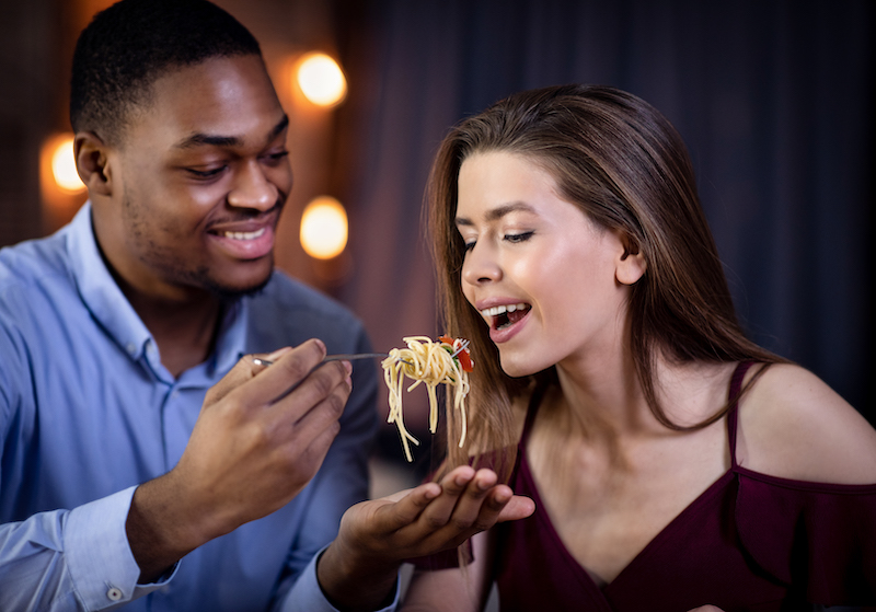 Man Feeding His Girlfriend With Spaghetti