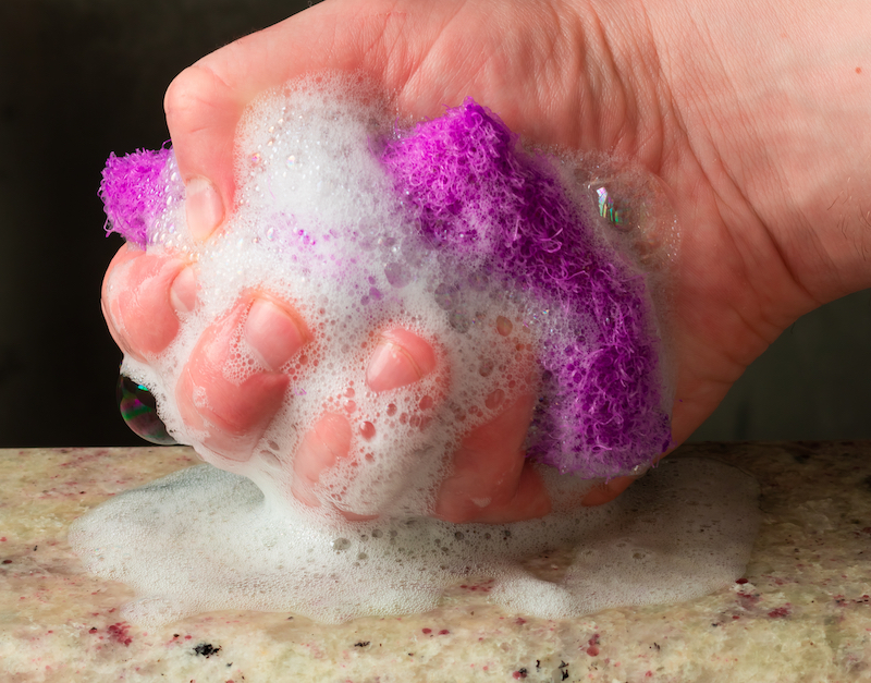 lady squeezing sponge