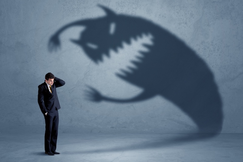 man faces fears as shadow monster attacks him